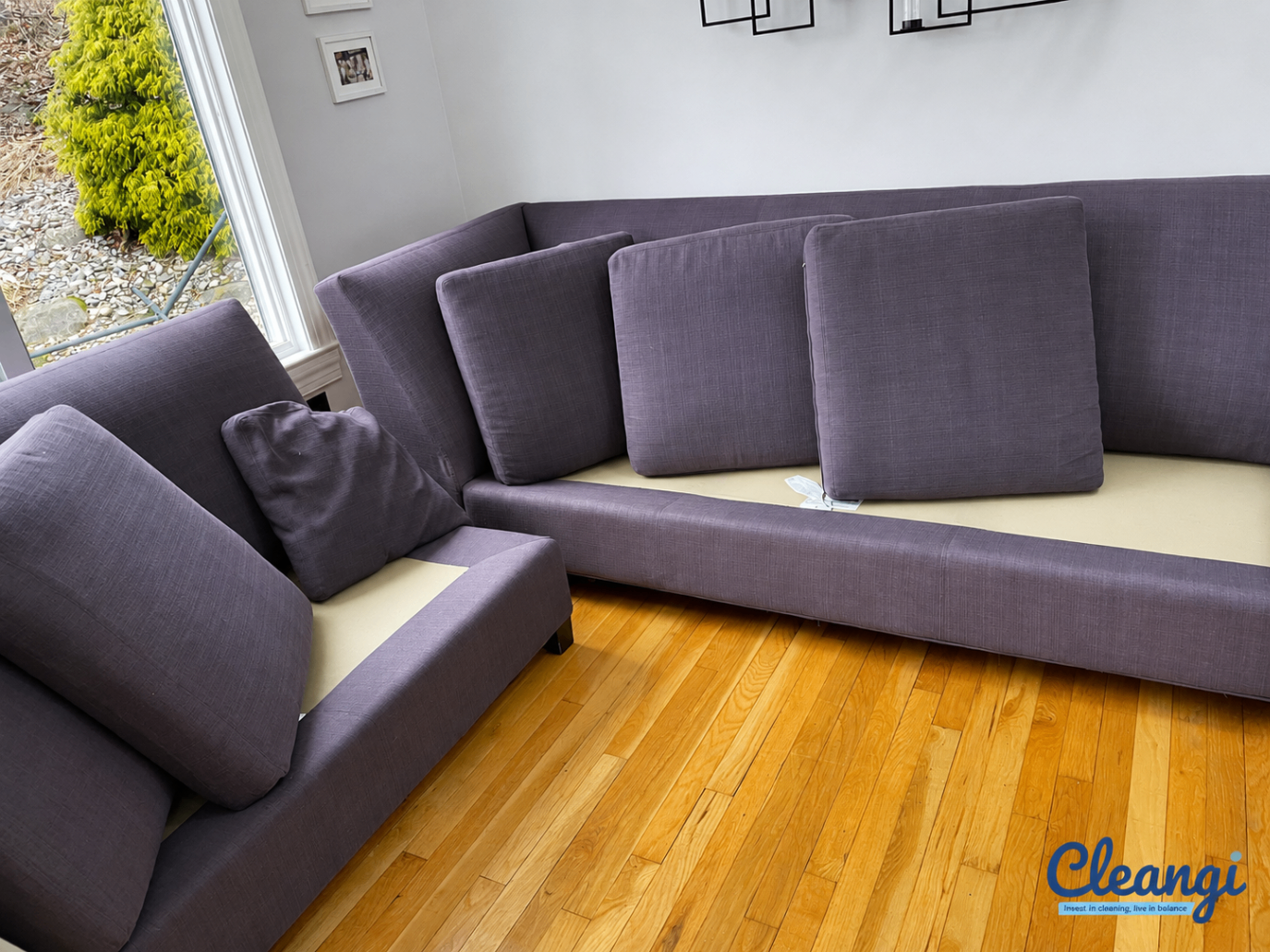 Sectional sofa prepared for upholstery cleaning