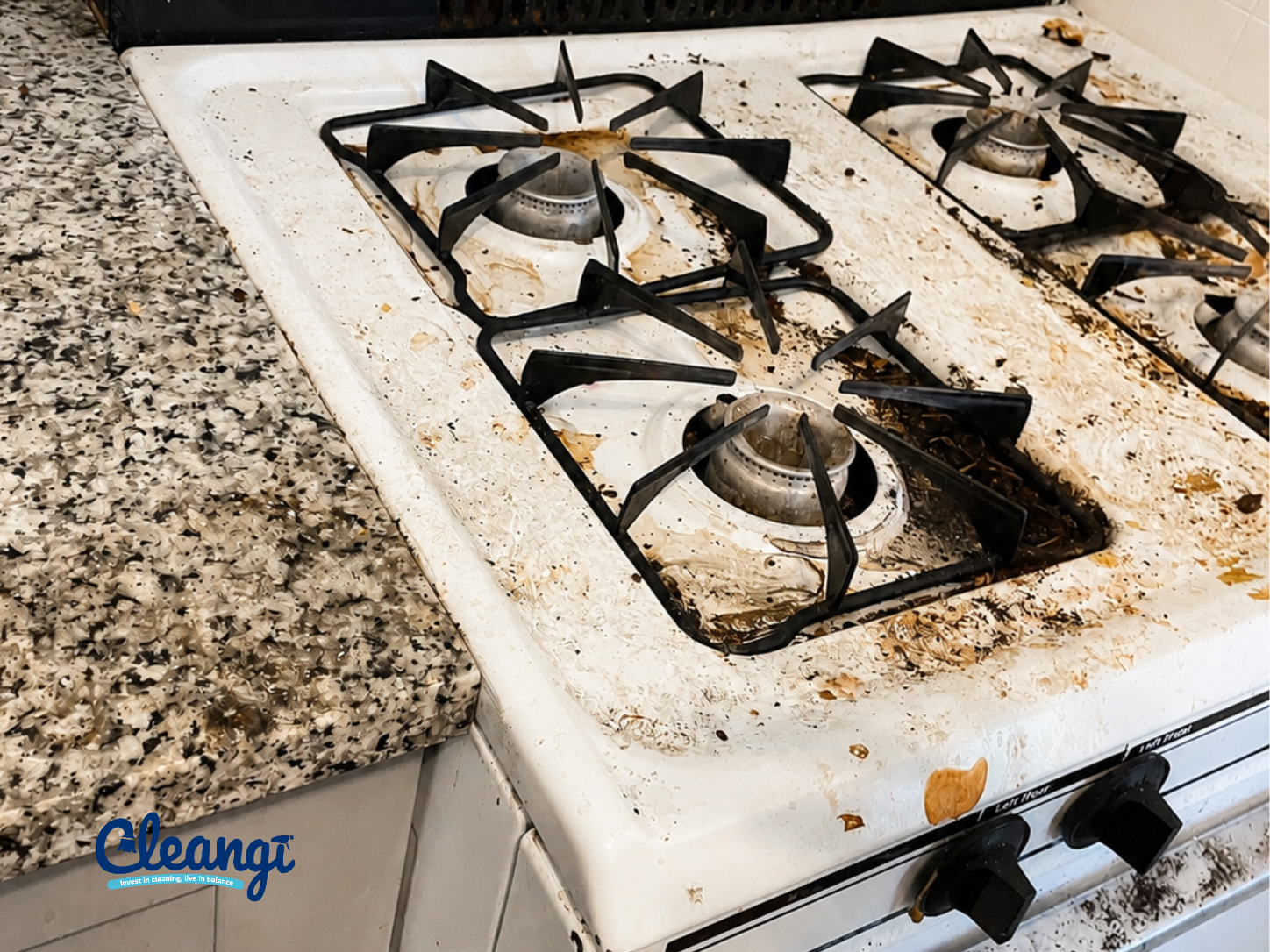 Gas stovetop covered with grease and burnt residue before cleaning